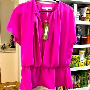 Short sleeve Trina Turk Heron Top. Size Large. Never worn. Tags still attached.